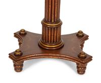 A Regency Style Mahogany and Parcel Gilt Side Table