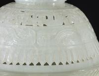 A Chinese Carved and Pierced 'Archaistic' White Jade Bowl and Cover