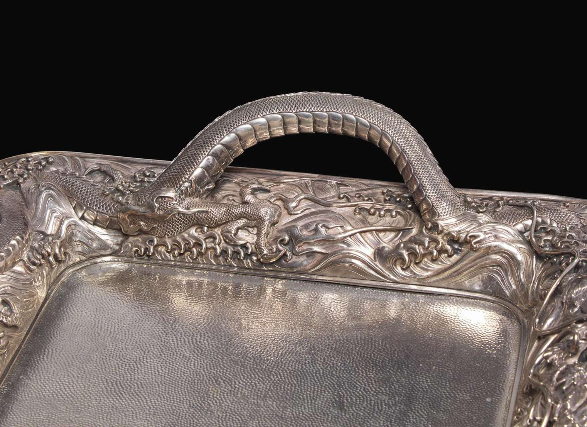 An impressive Japanese export silver four-piece "Dragon" tea and coffee service with tray, retailed by Arthur & Bond, Yokohama, late 19th/early 20th century 日式銀質咖啡器茶具四件及托盤 十九世紀末或二十世紀初