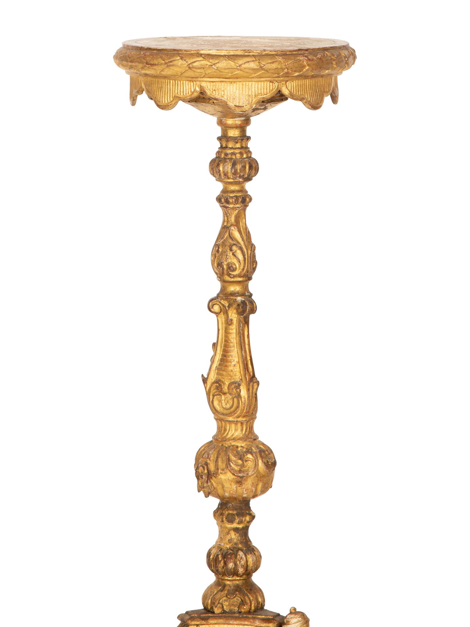 An Italian Giltwood Pedestal Table and a Torchère Mounted as a Floor Lamp