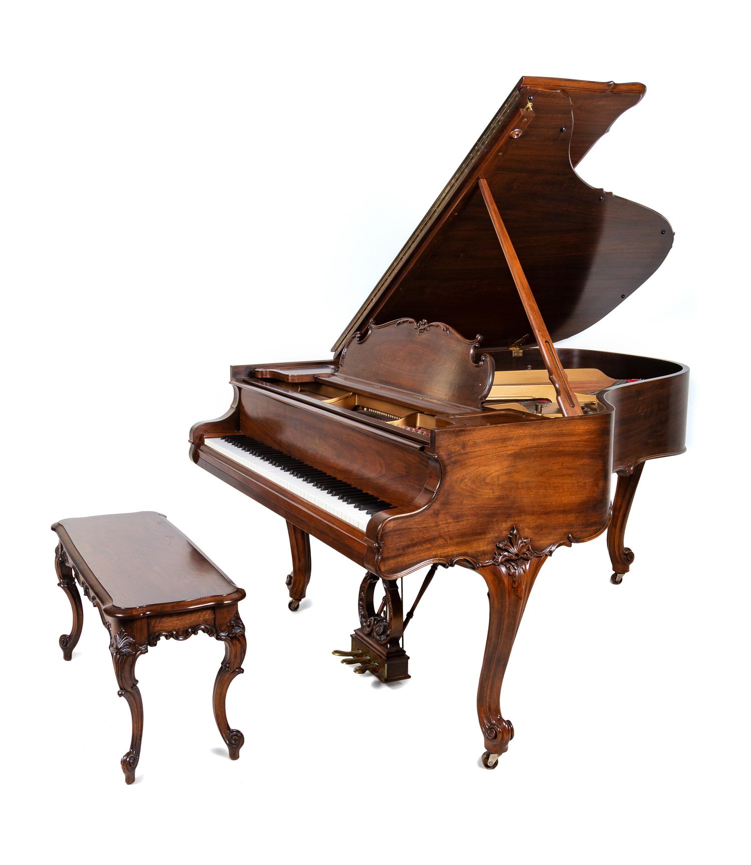 A Steinway & Sons Walnut Baby Grand Piano