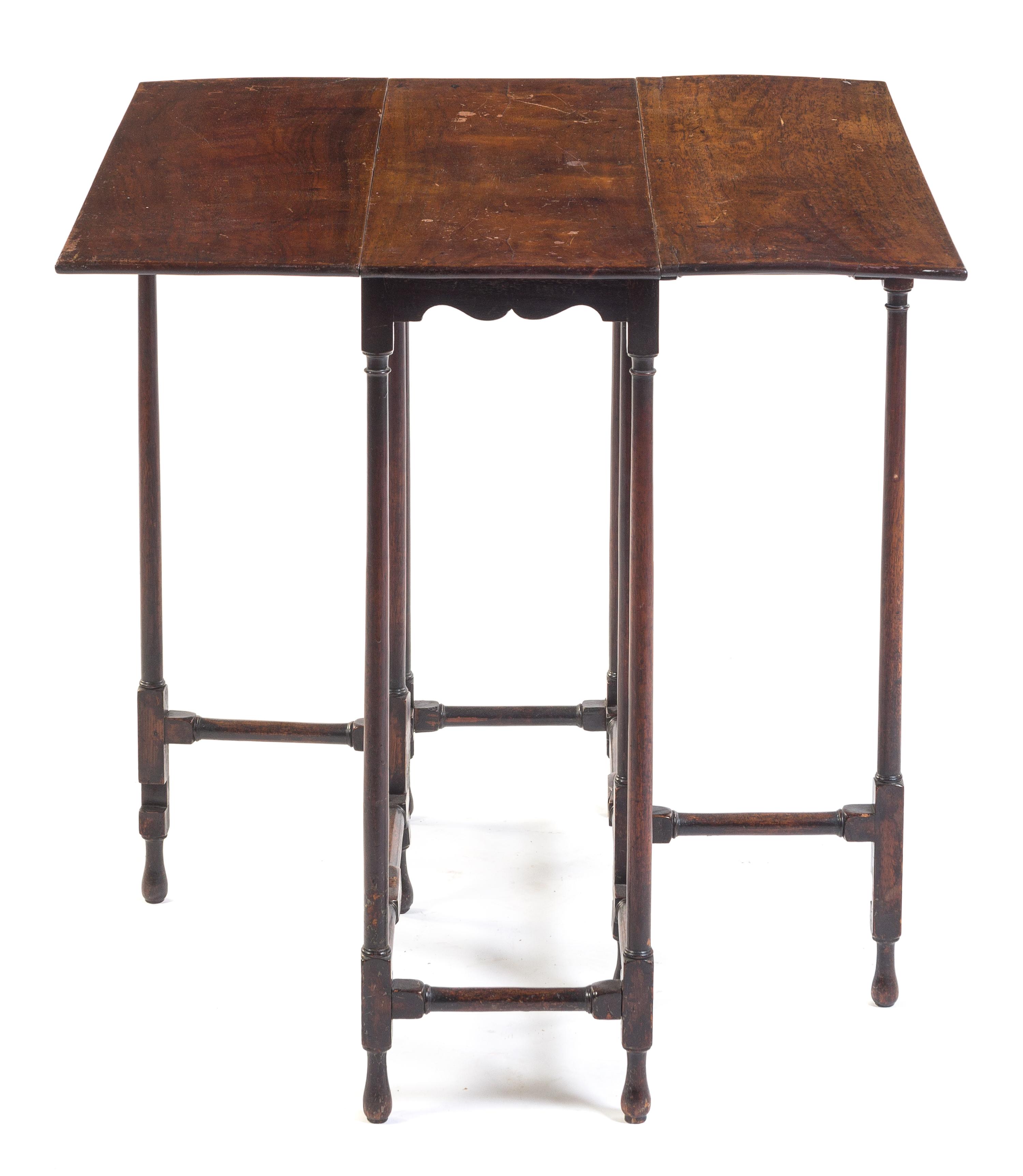 A Regency Mahogany Gateleg Table Height 28 x width 30 x depth 10 1/2 inches (closed).
