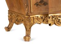 A Pair of Italian Walnut and Parcel Gilt Commodini