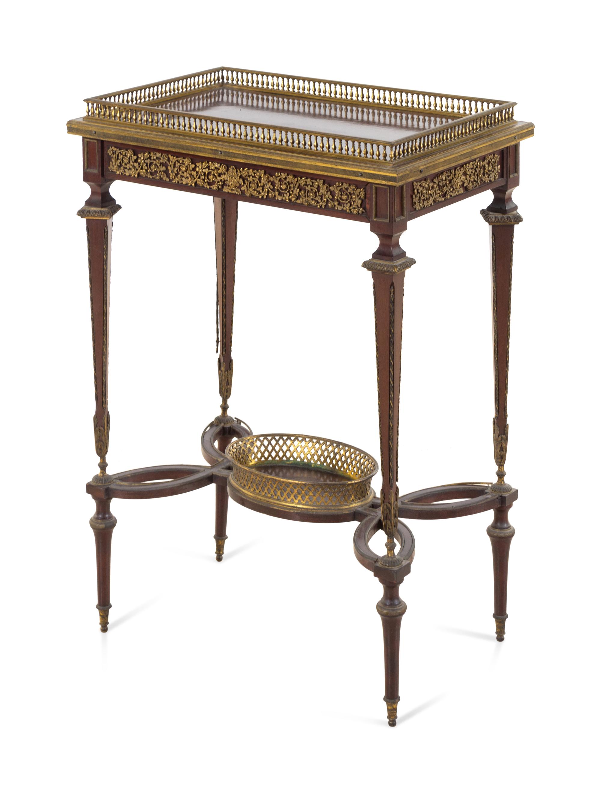A Louis XVI Style Gilt Bronze Mounted Mahogany Table