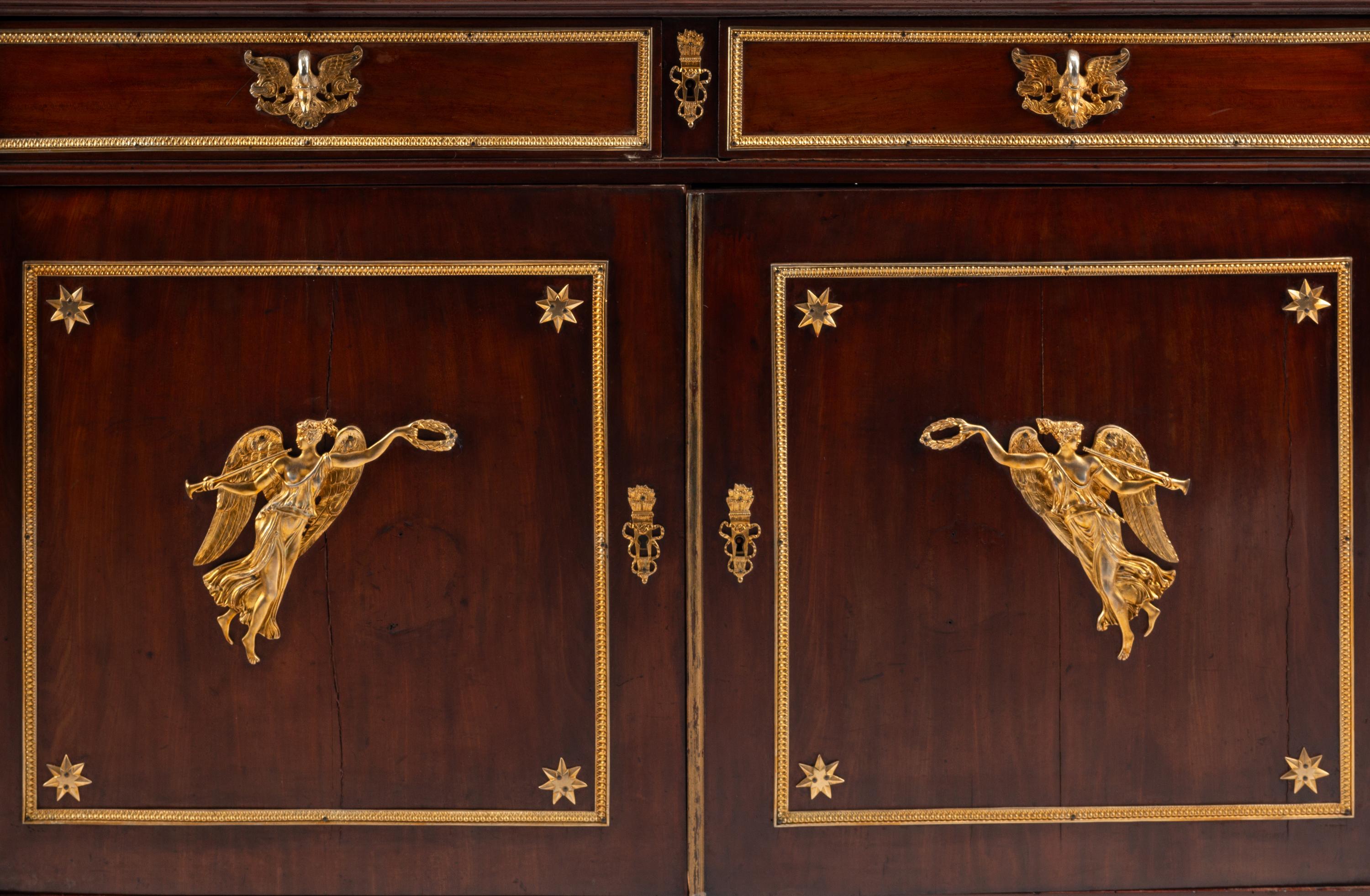 An Empire Style Gilt Bronze Mounted Mahogany Serving Cabinet