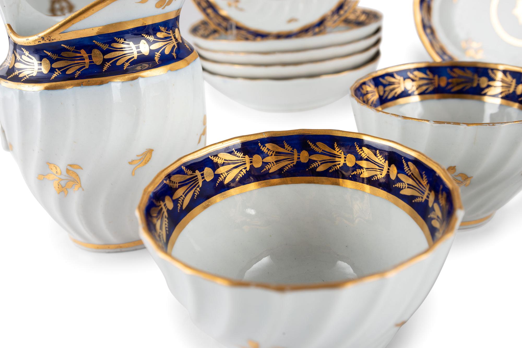 An English Gilt and Cobalt Decorated Porcelain Tea Service