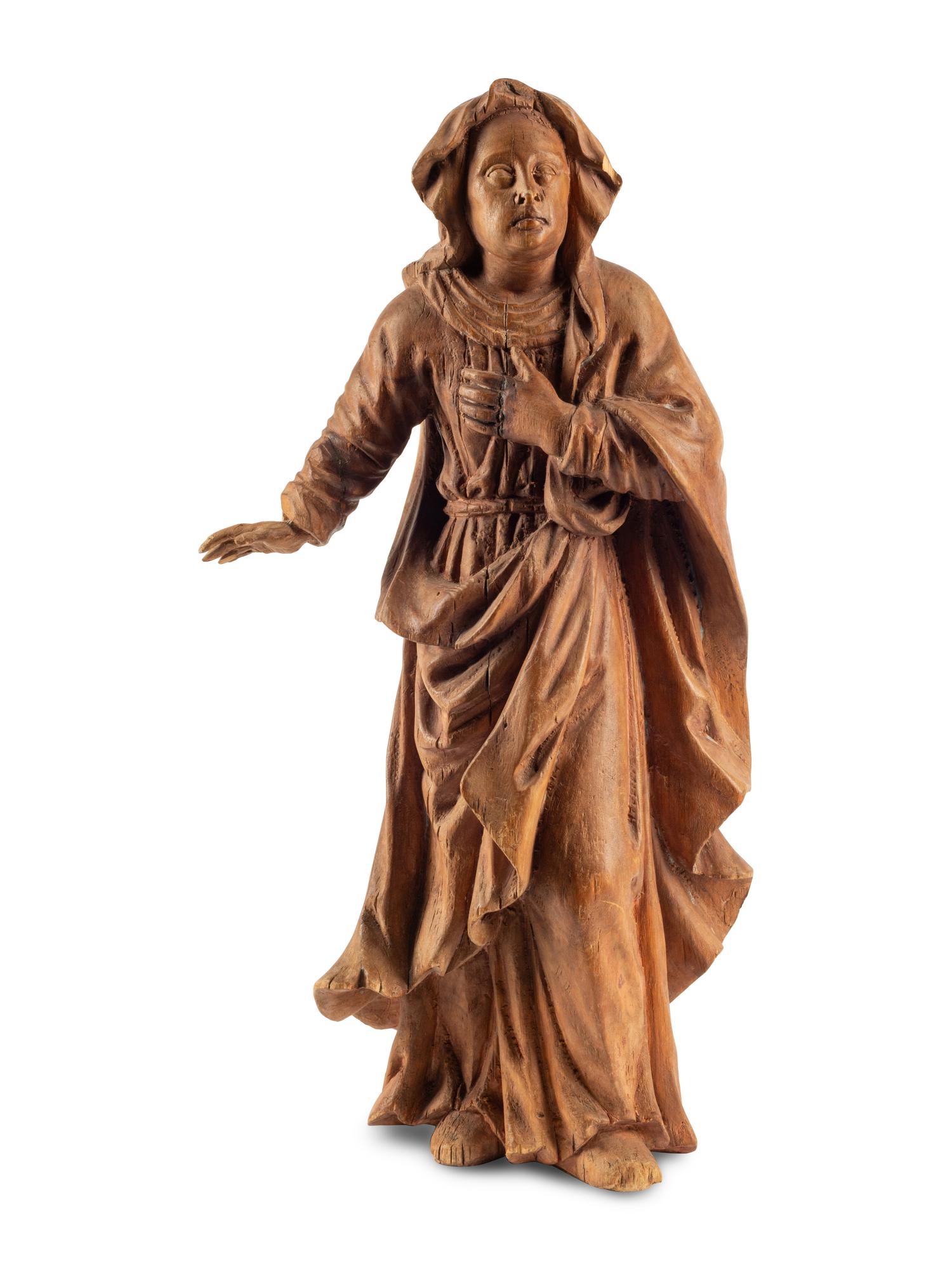A Continental Carved Fruitwood Saint Figure