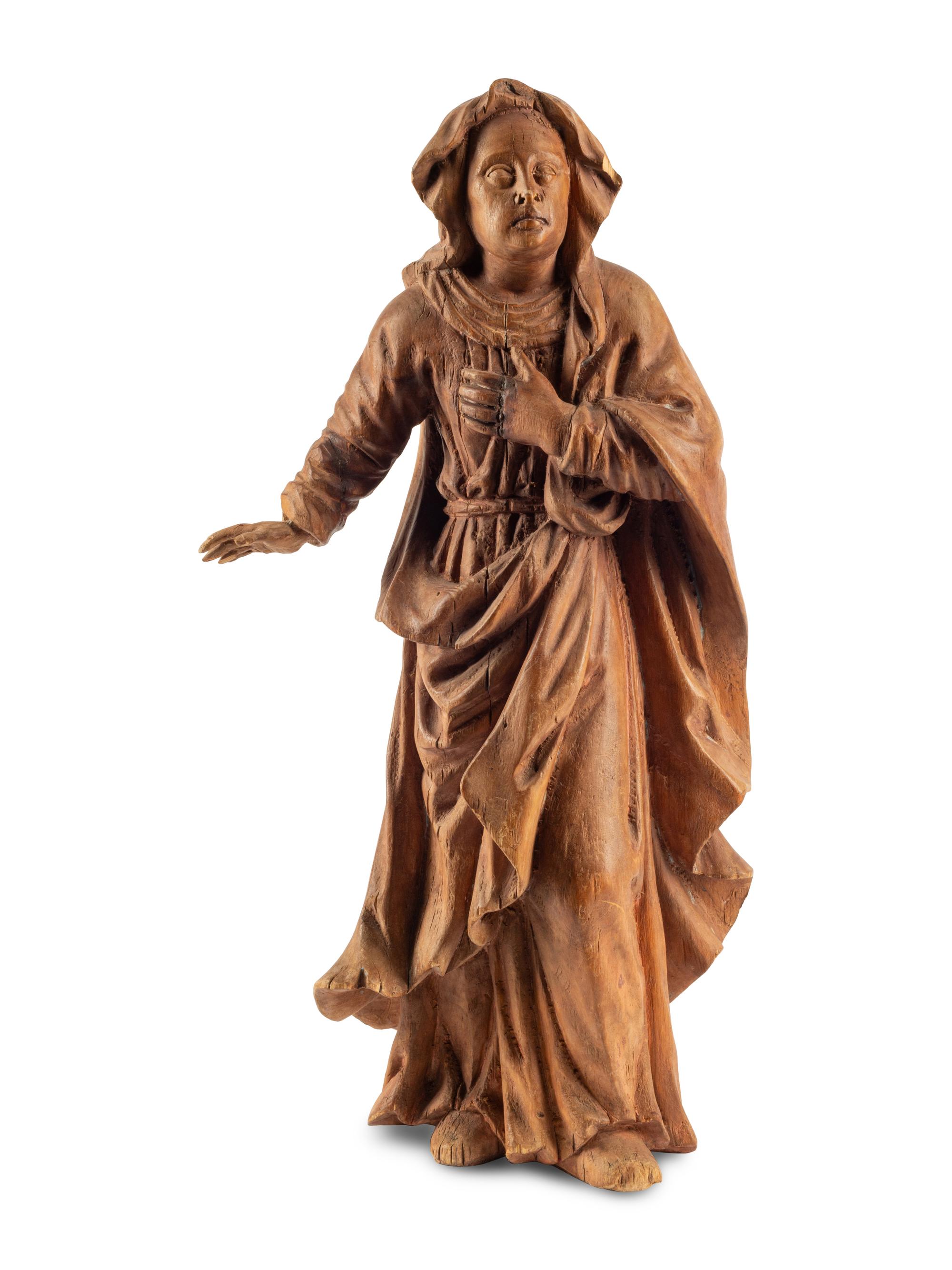 A Continental Carved Fruitwood Saint Figure