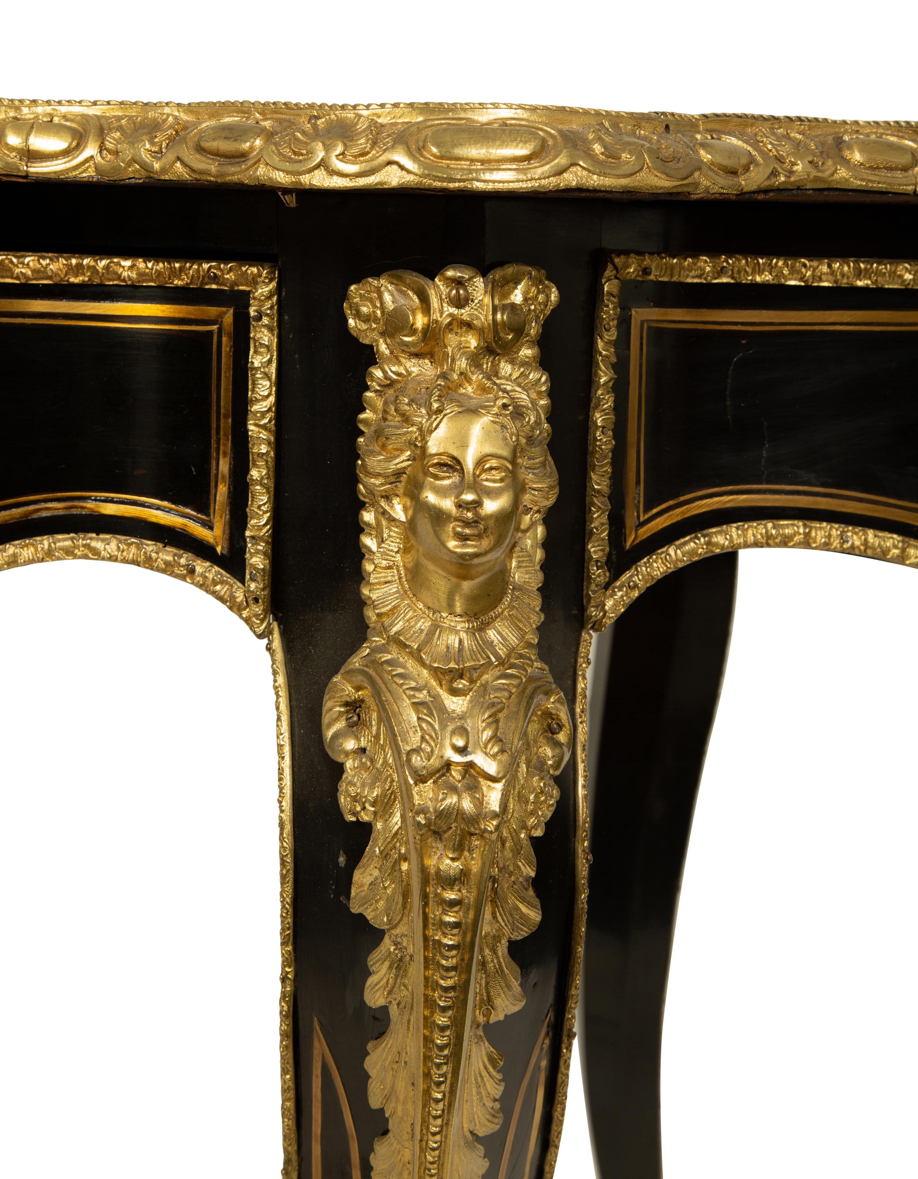A Napoleon III Style Gilt Bronze Mounted Ebonized Writing Table — LATE 19TH CENTURY