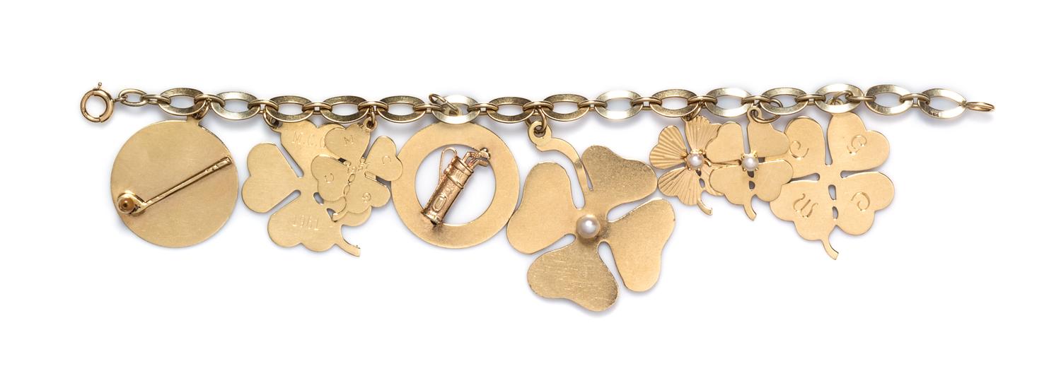 A 14 Karat Yellow Gold Charm Bracelet, 19.90 dwts.