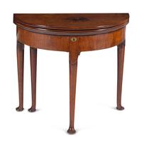 A George I Walnut Demilune Game Table