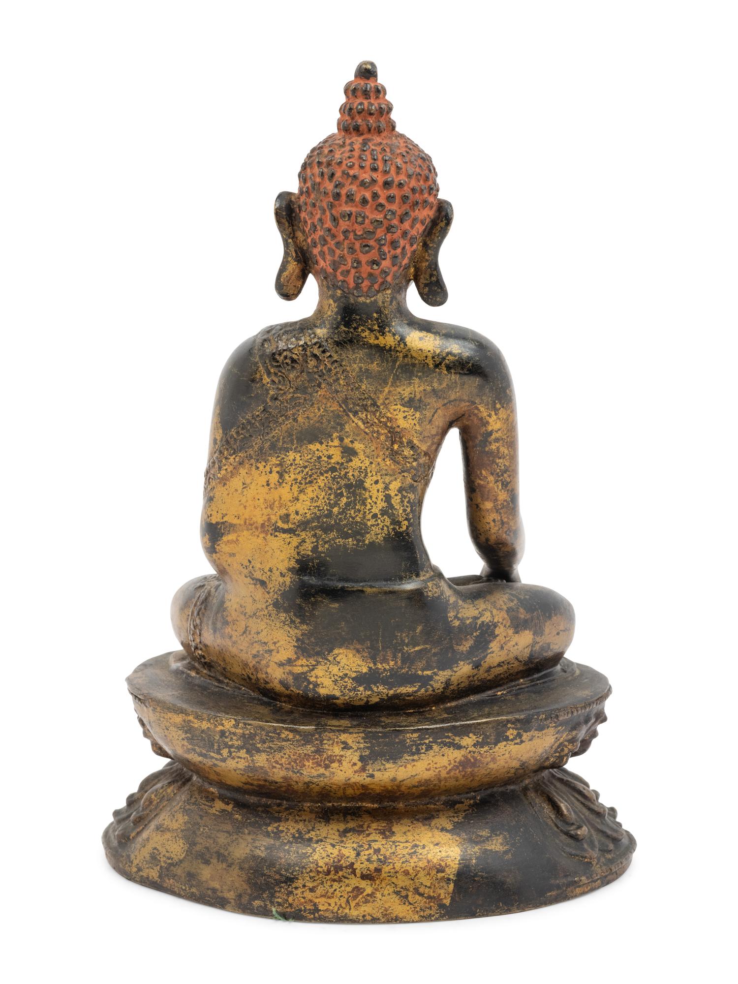 A Large Nepalese Gilt Bronze Figure of Seated Buddha