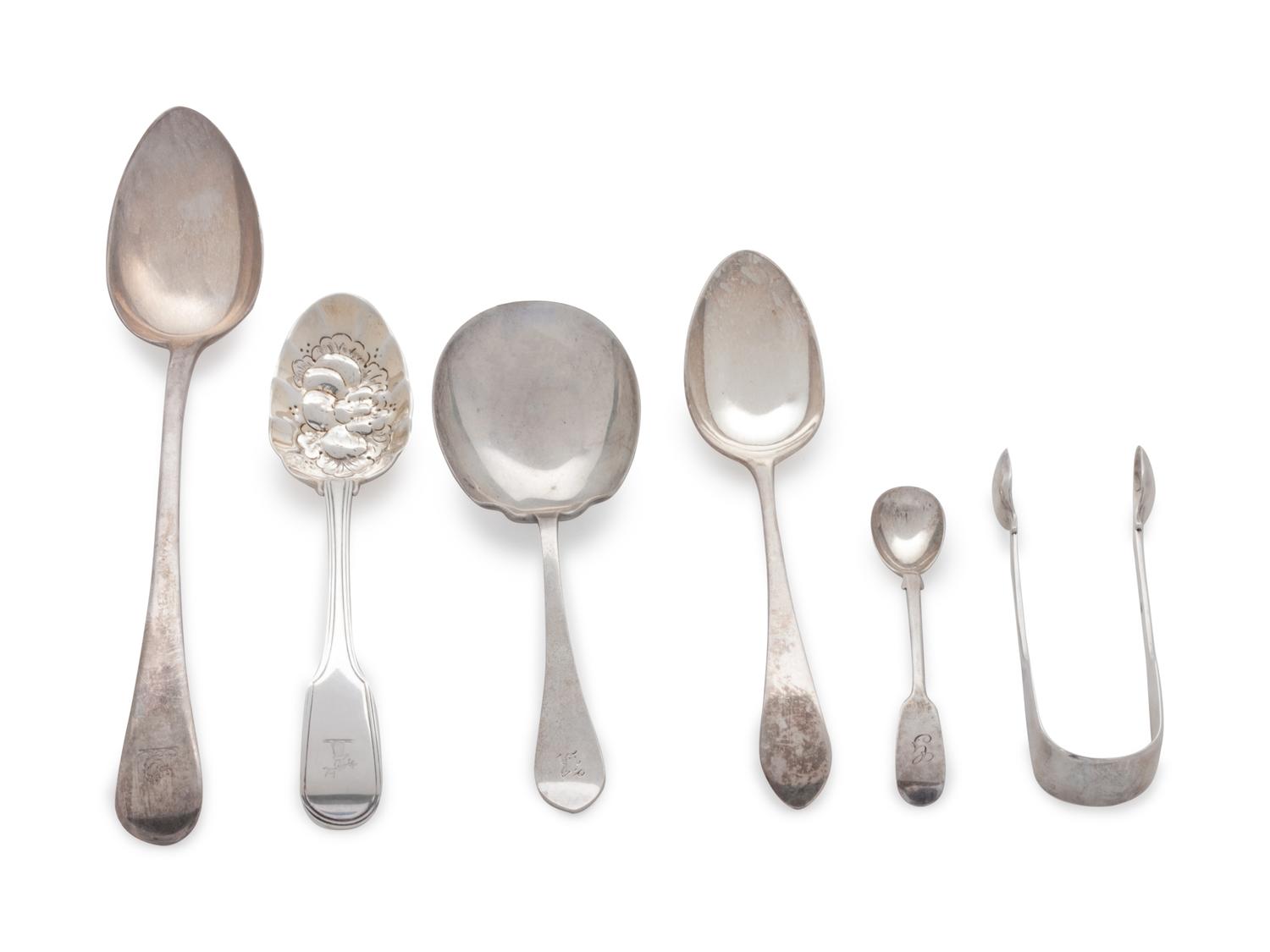 comprising: 2 berry spoons a large serving spoon a tablespoon a set of sugar tongs an egg spoon a nut scoop 7 items total.