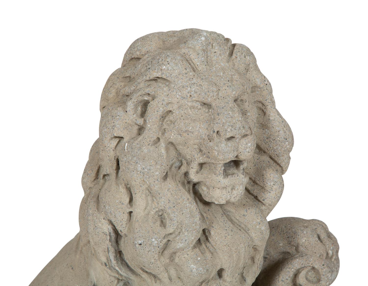 A Pair of Cast Stone Seated Lions