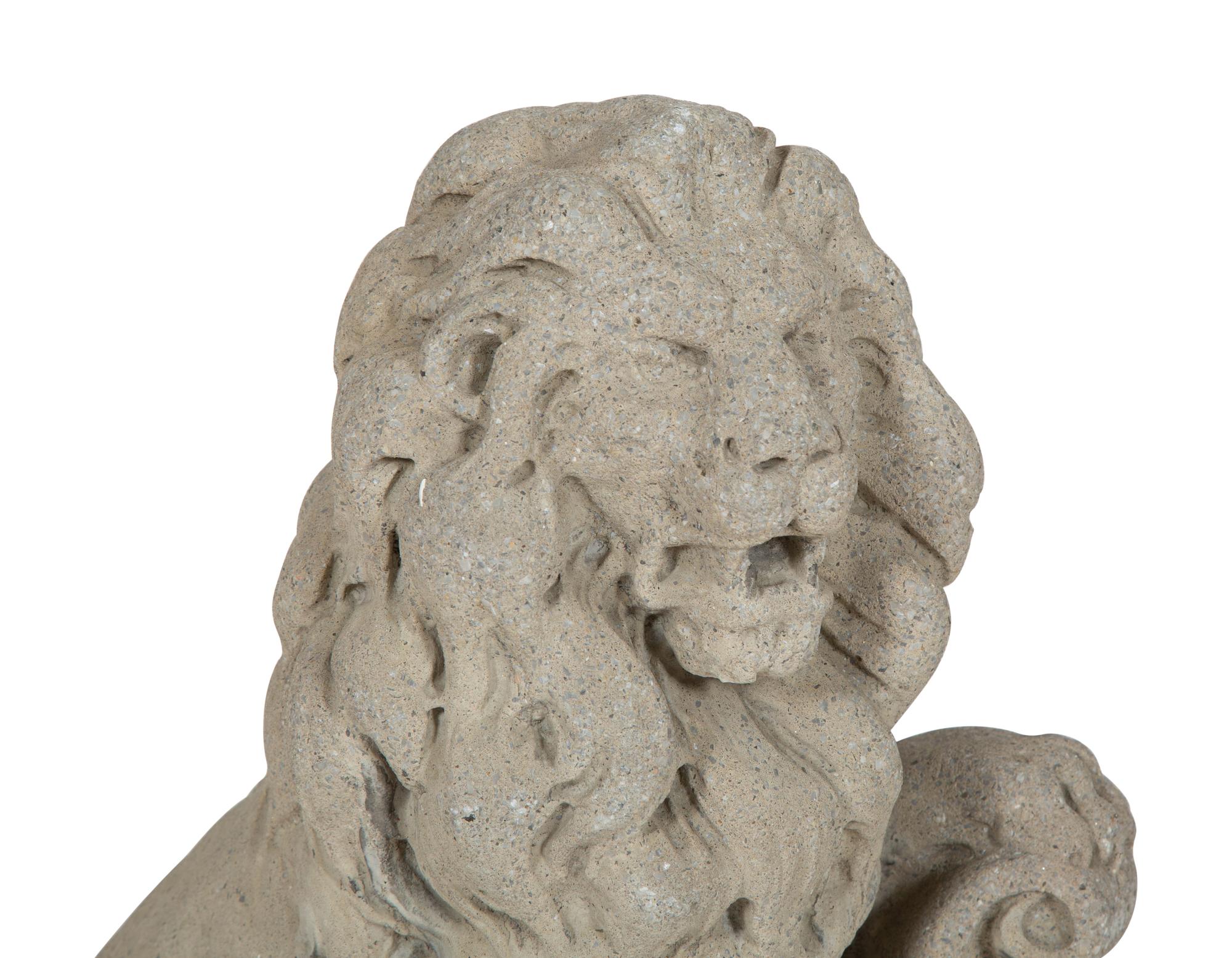 A Pair of Cast Stone Seated Lions