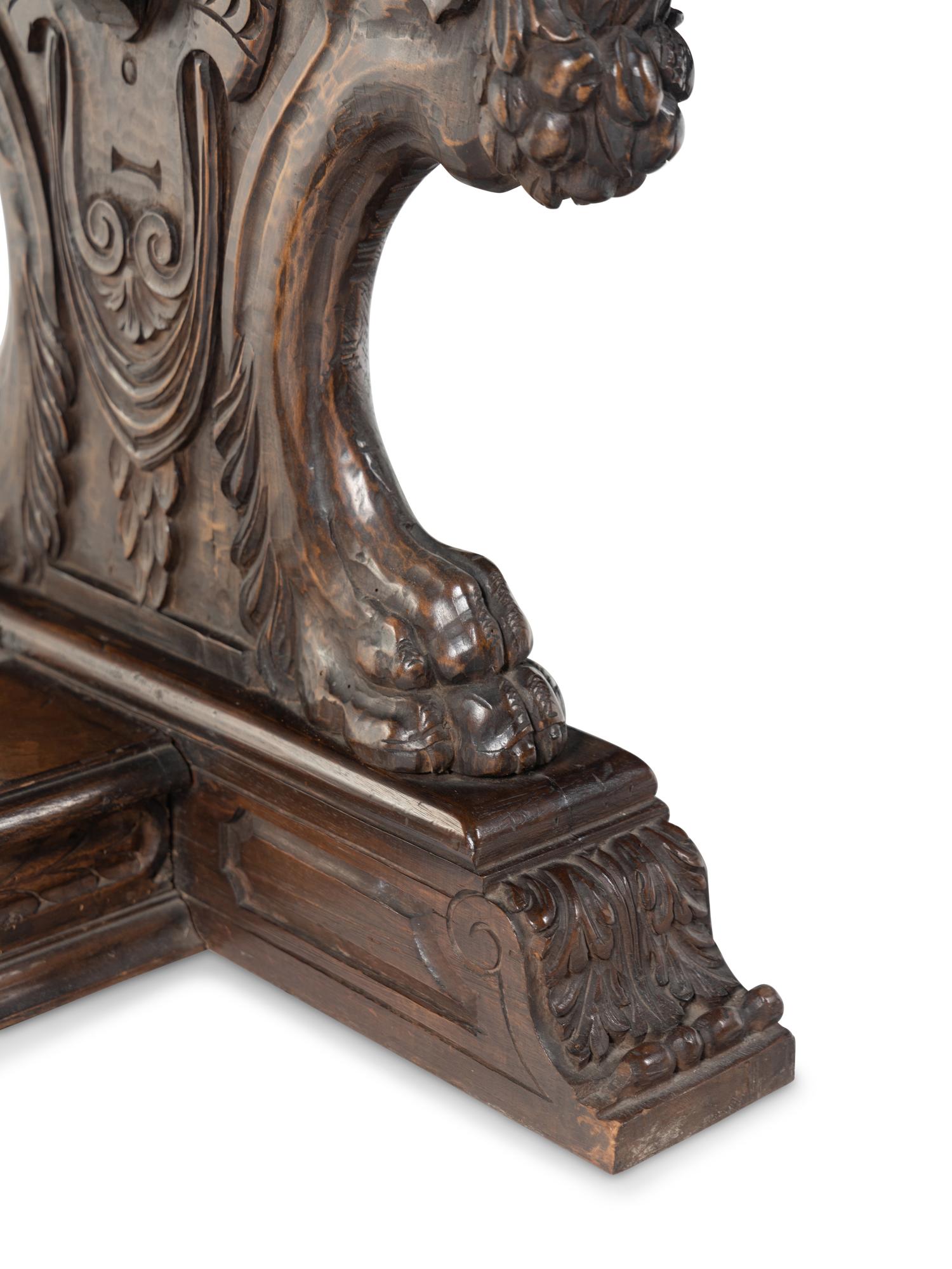 A Florentine Renaissance Style Carved Walnut Trestle Table