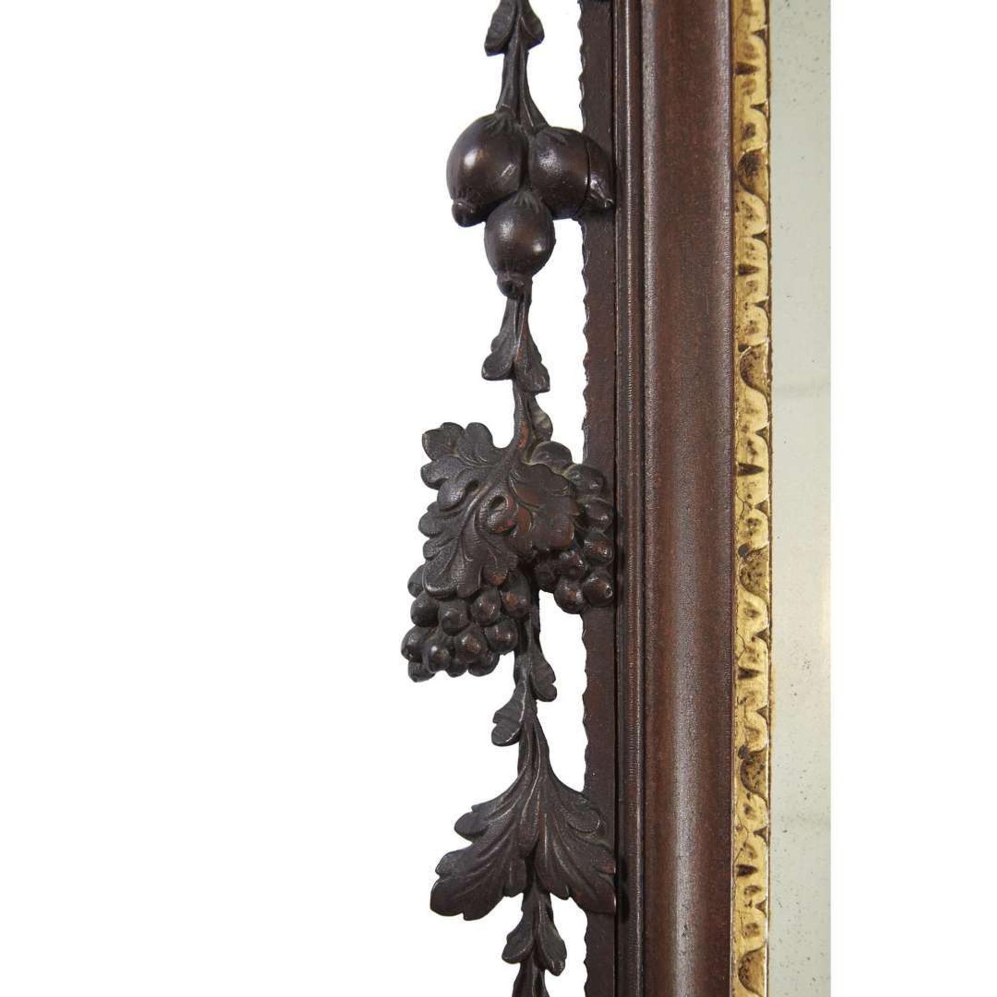 Chippendale carved mahogany looking glass with phoenix cartouche Philadelphia, PA, carving attributed to John Pollard (1740-1787) and