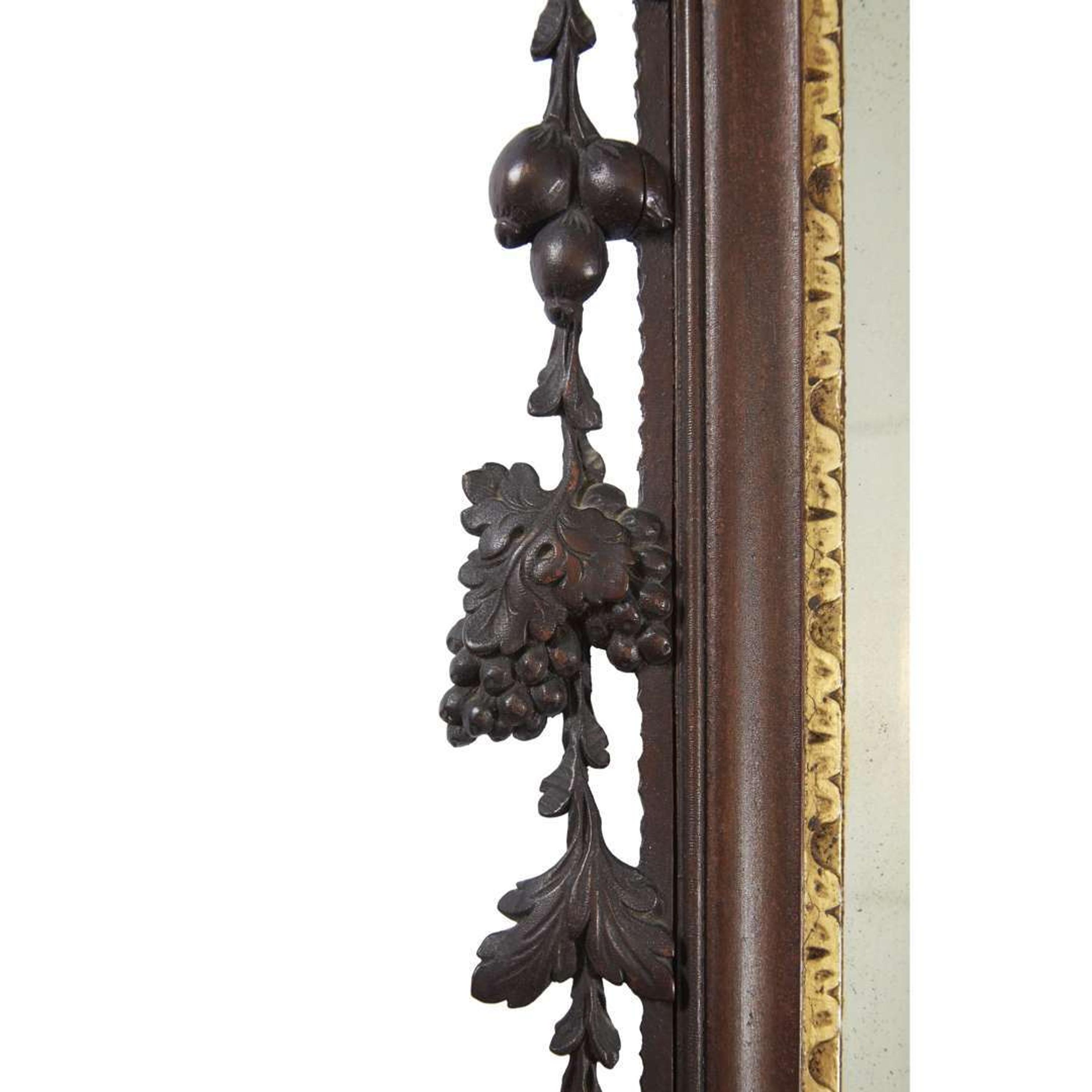 Chippendale carved mahogany looking glass with phoenix cartouche Philadelphia, PA, carving attributed to John Pollard (1740-1787) and