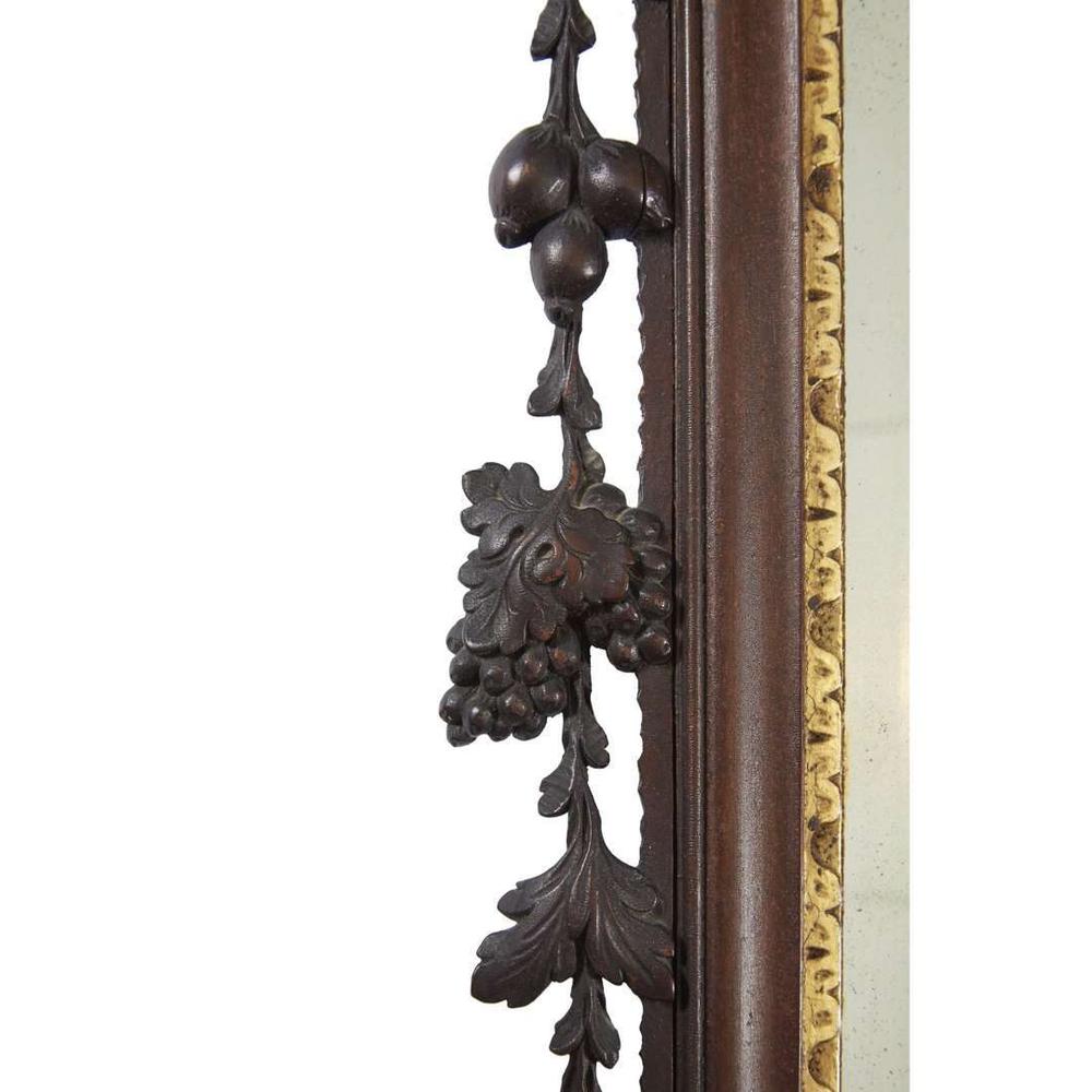<strong>Chippendale carved mahogany looking glass with phoenix cartouche</strong> Philadelphia, PA, carving attributed to John Pollard (1740-1787) and