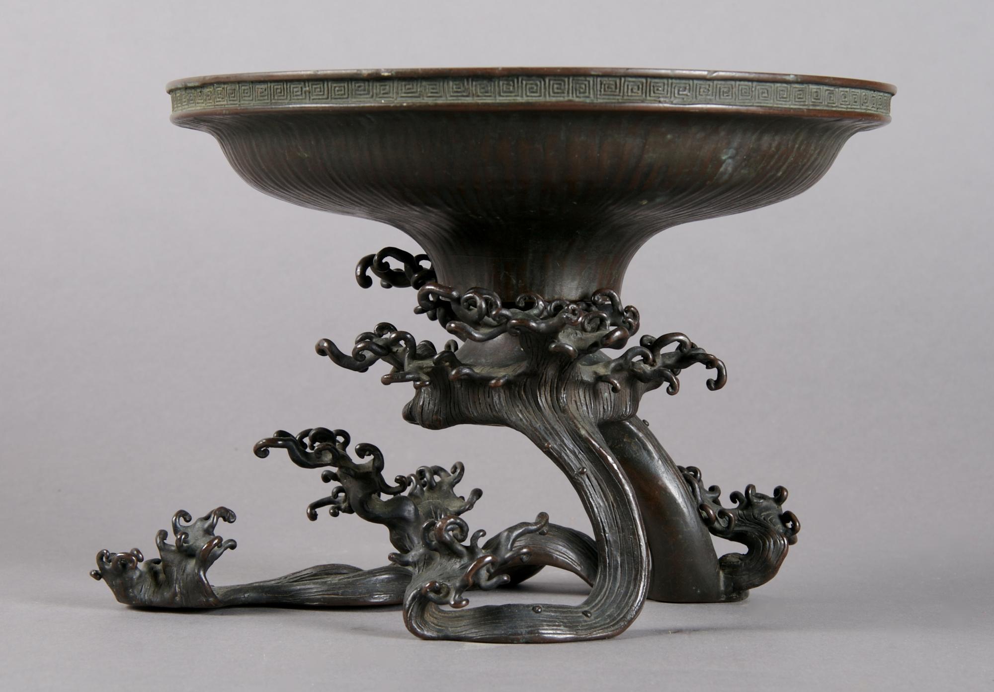 A Japanese Bronze Ikibana, Height 6 inches, diameter 8 1/8 inches.
