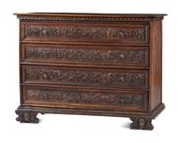 A Baroque Highly Carved Walnut Commode