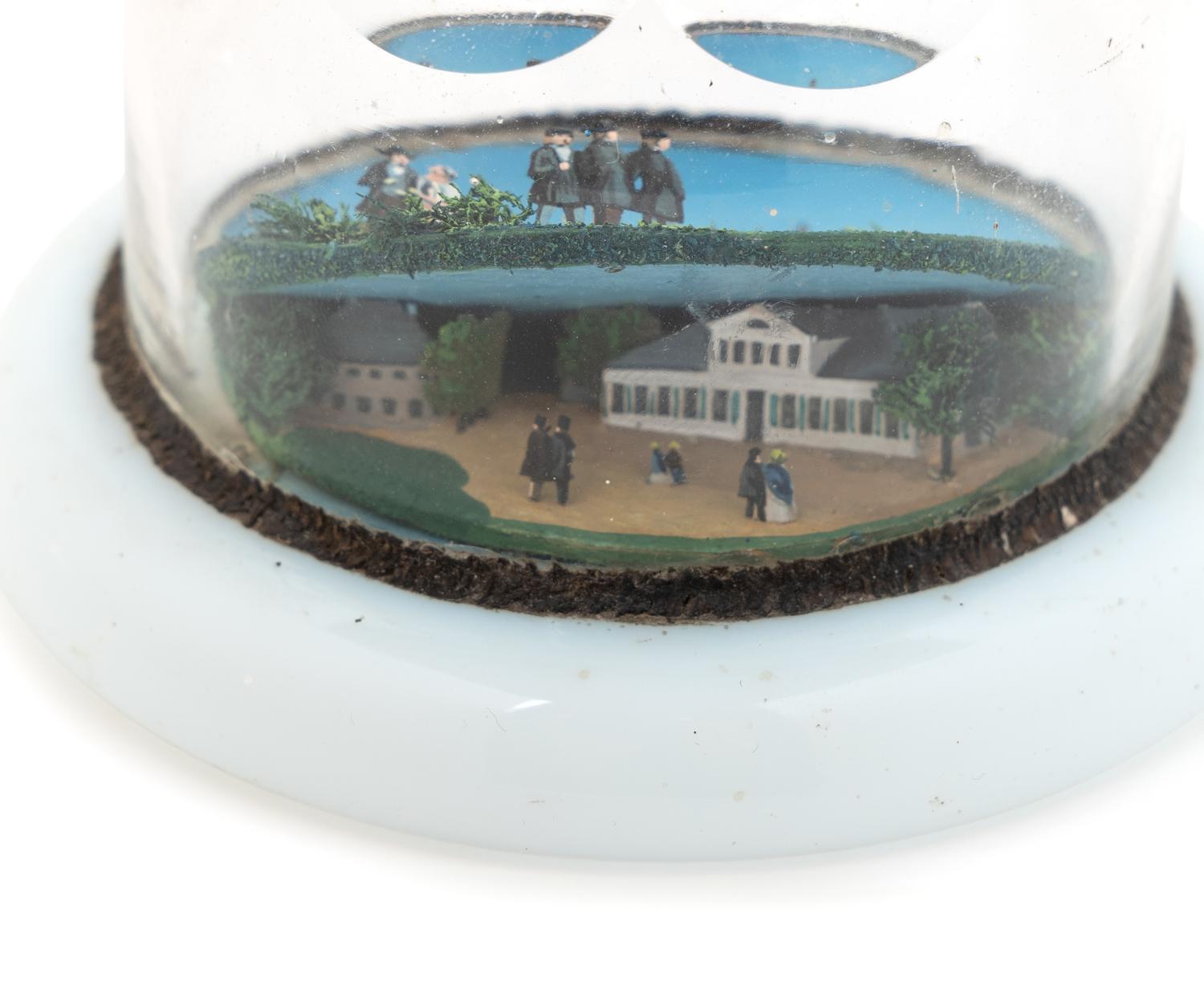 A Village Scene Diorama Faceted Glass Paperweight and a Commemorative Glass Paperweight