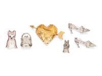 A COLLECTION OF RED BROOCHES