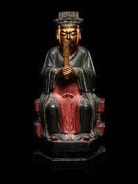 A Chinese Gilt, Red, and Black Lacquered Wood Figure of an Official