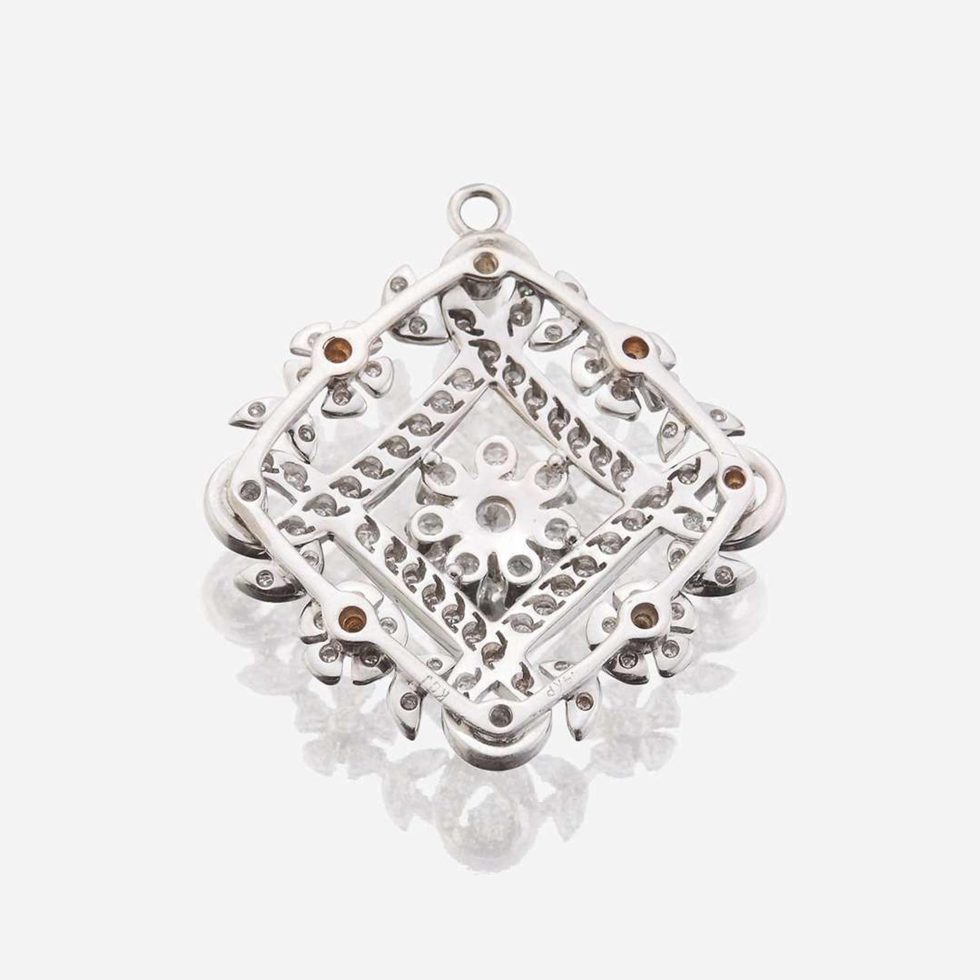 A fourteen karat gold and diamond pendant