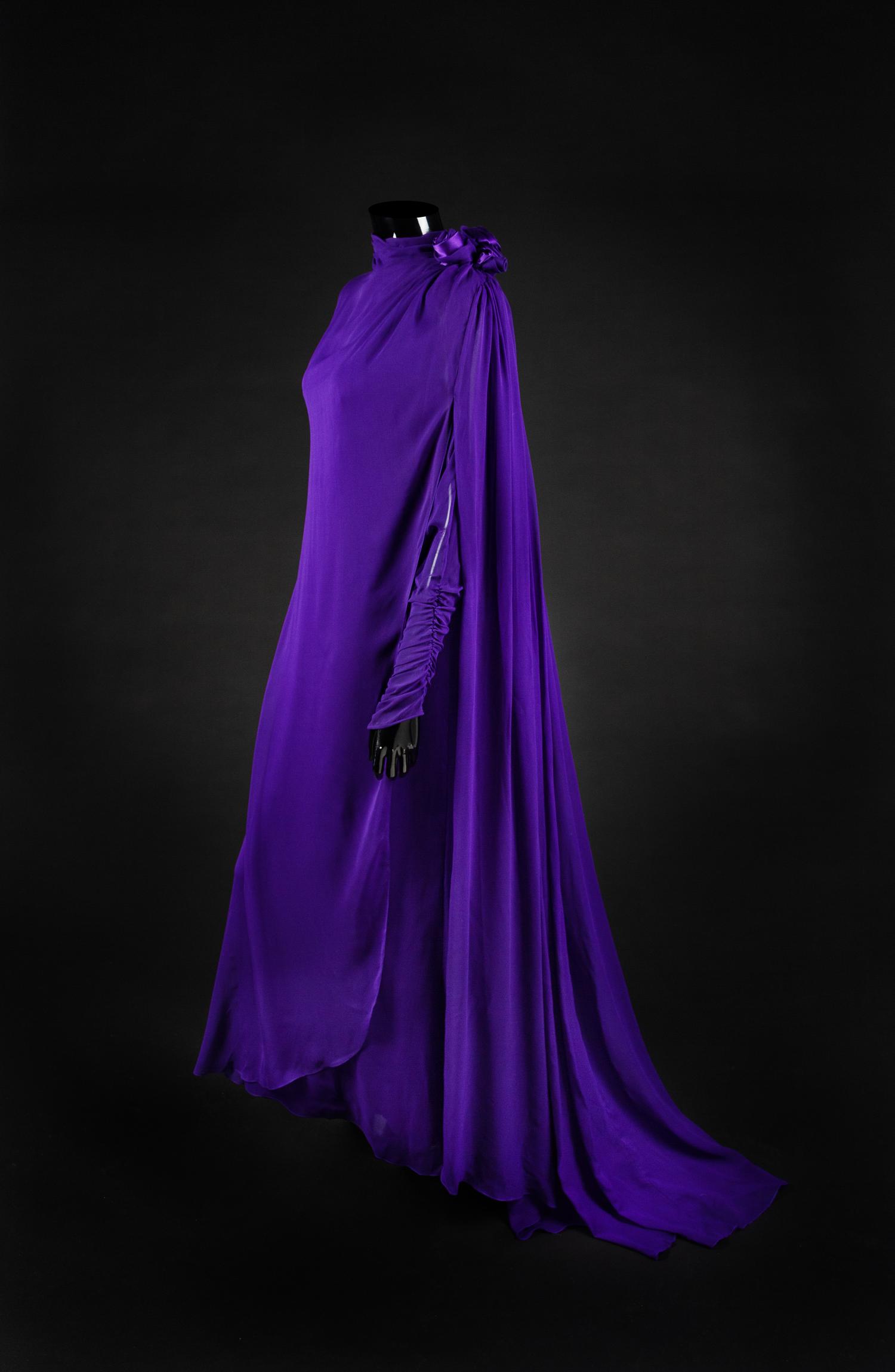 Dress, Earrings and Bag, 1987. Dress designed by Paul Zastupnevitch and made by Western Costume Company in Los Angeles — Worn by Olivia de Havilland at the Golden Globes Awards in 1987 to accept a Golden Globe Award for Best Supporting Actress in a Series, Mini Series or Motion Picture made for TV for her role in ‘Anastasia: The Mystery of Anna’.