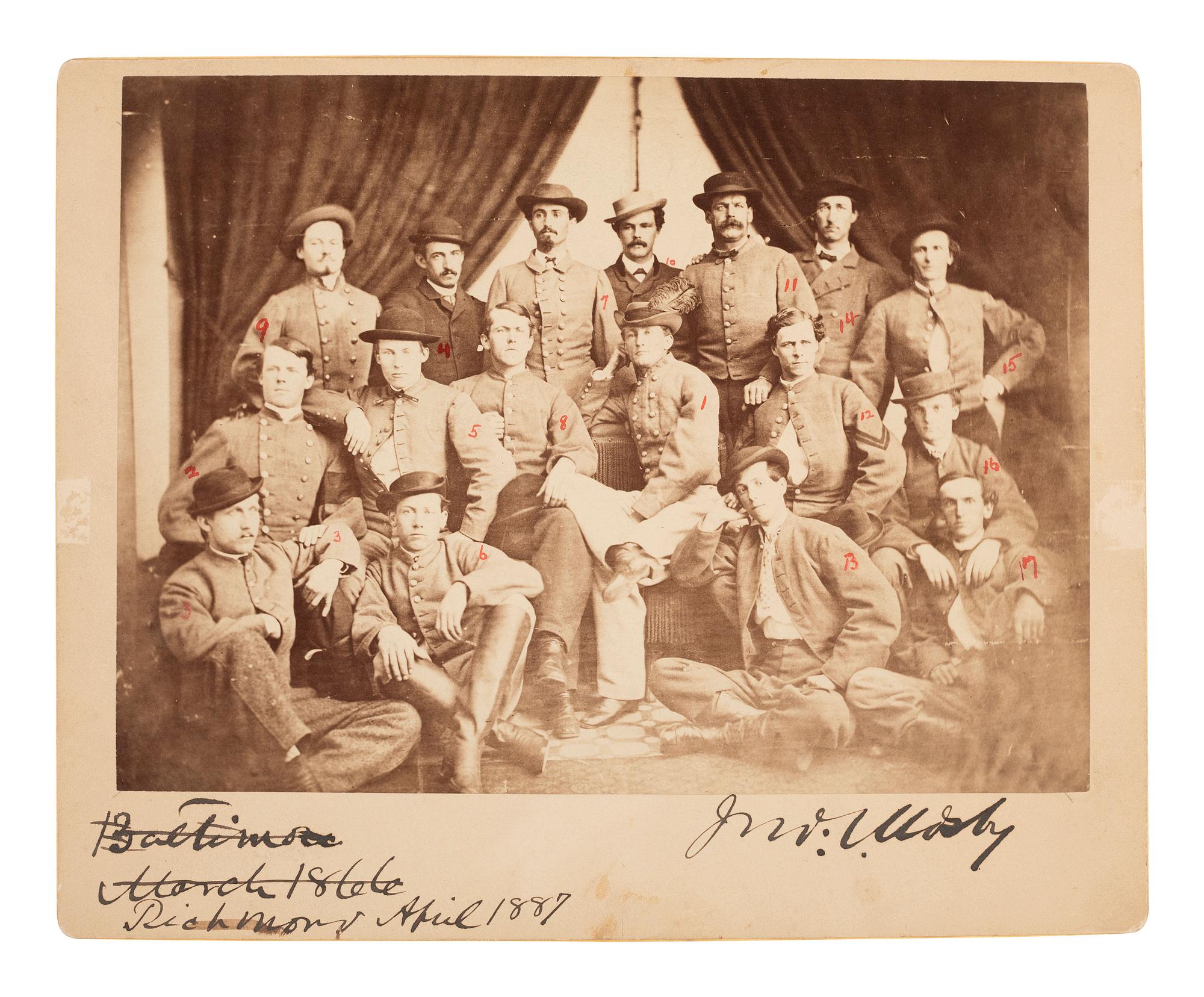 [MOSBY, JOHN. S. (1833-1916)]. Albumen photograph featuring Mosby and 16 members of the 43rd Virginia Cavalry Battalion, or "Mosby's Rangers," signed and inscribed by Mosby ca 1887.