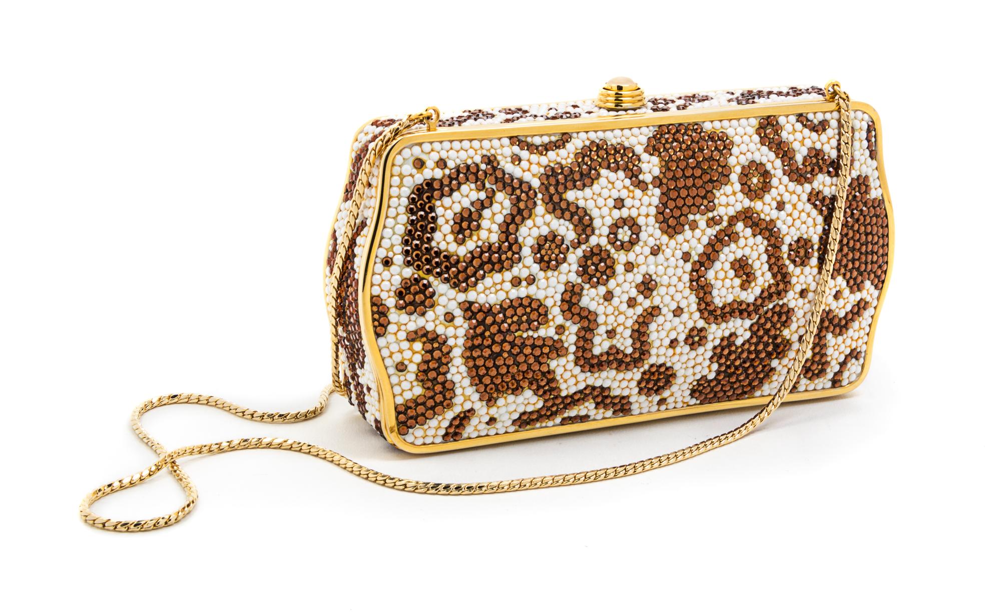 A Judith Leiber Brown and Ivory Swarovski Crystal Minaudiere, 6 1/2 x 4 x 1 1/2 inches.