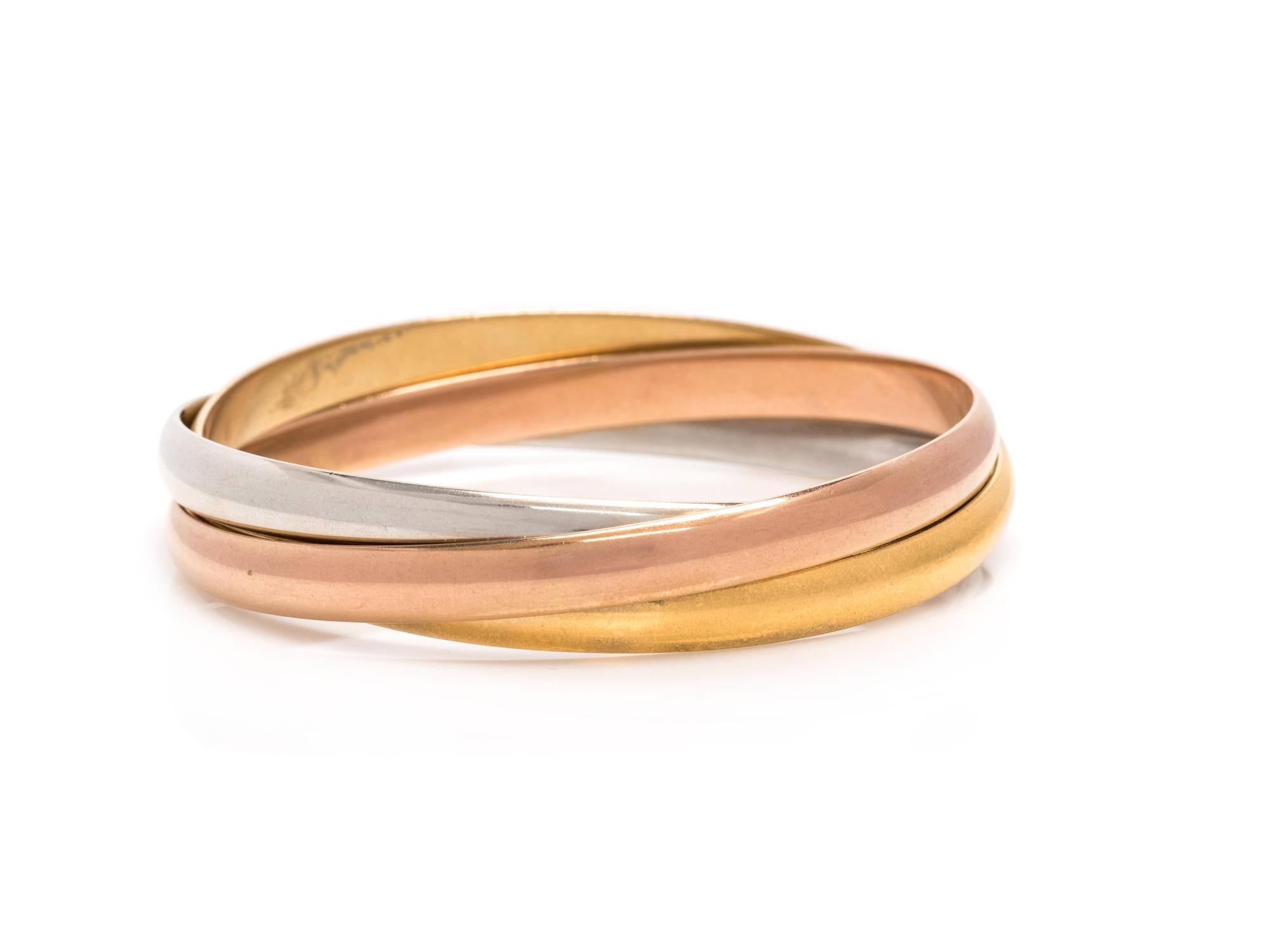 CARTIER, TRICOLOR GOLD 'TRINITY' BANGLE BRACELET