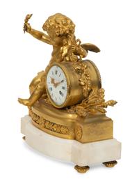 A Louis XVI Style Gilt Bronze and White Marble Mantel Clock