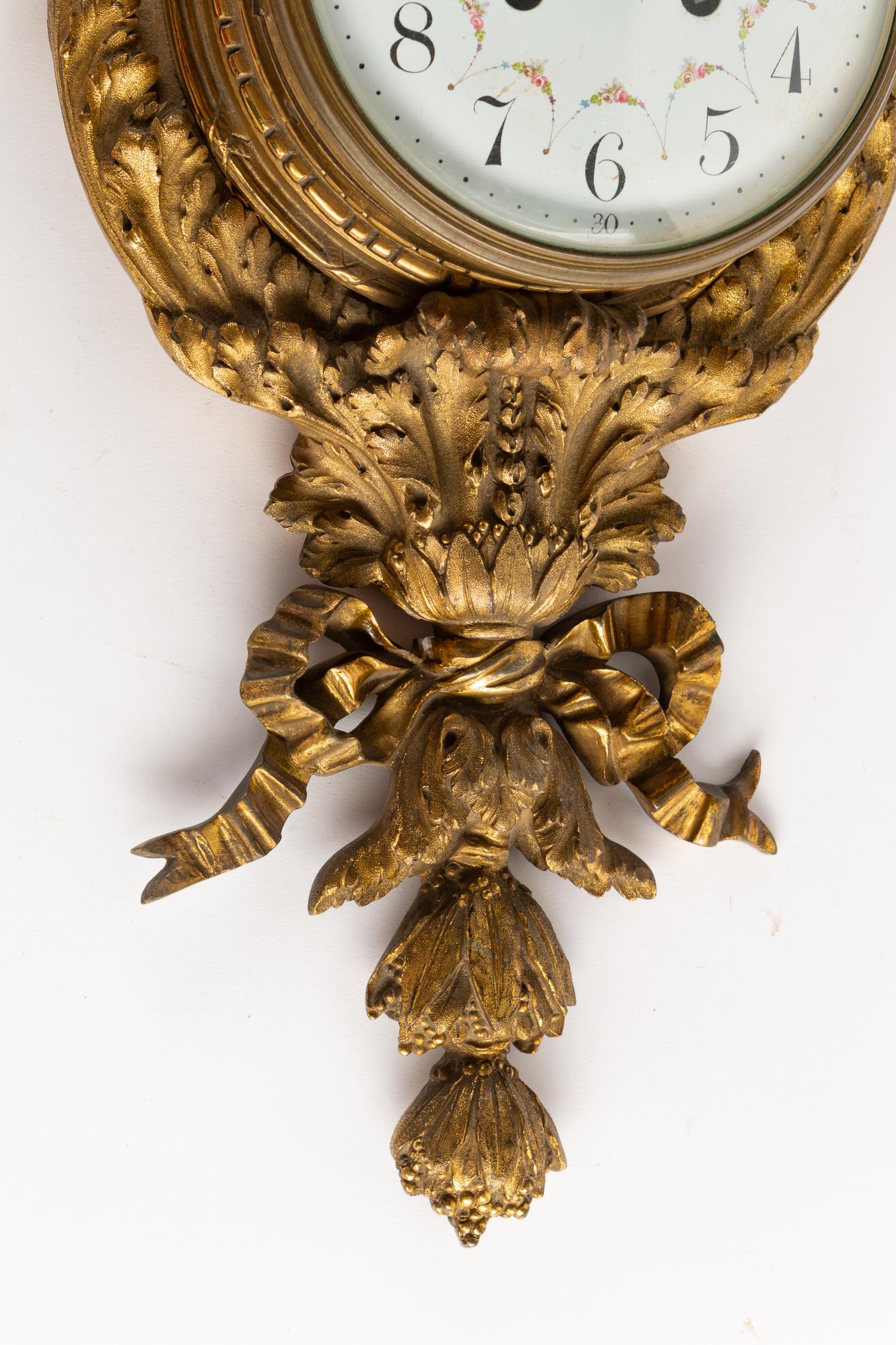 A Louis XVI Style Gilt Bronze Cartel Clock