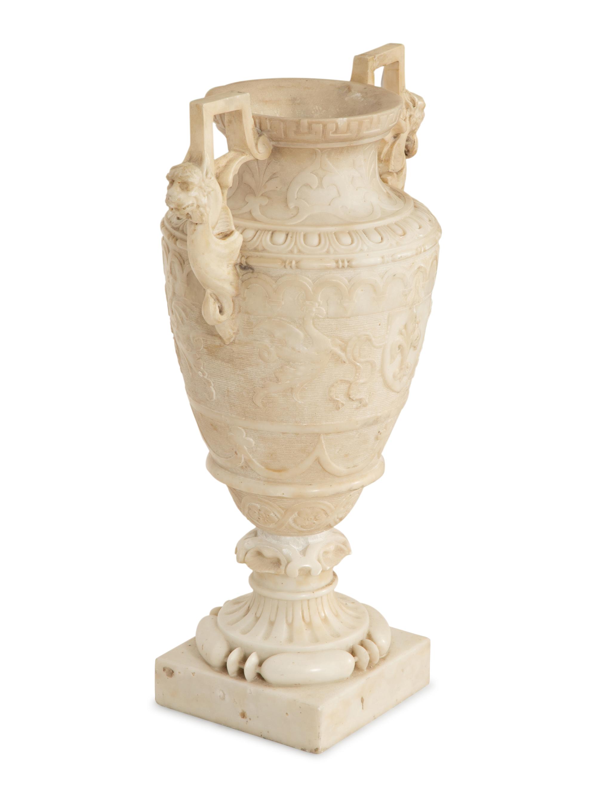 An Italian Carved Marble Urn with Griffin Handles