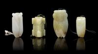 Four Carved Jade Pendants Length of longest 2 3/4 inches.
