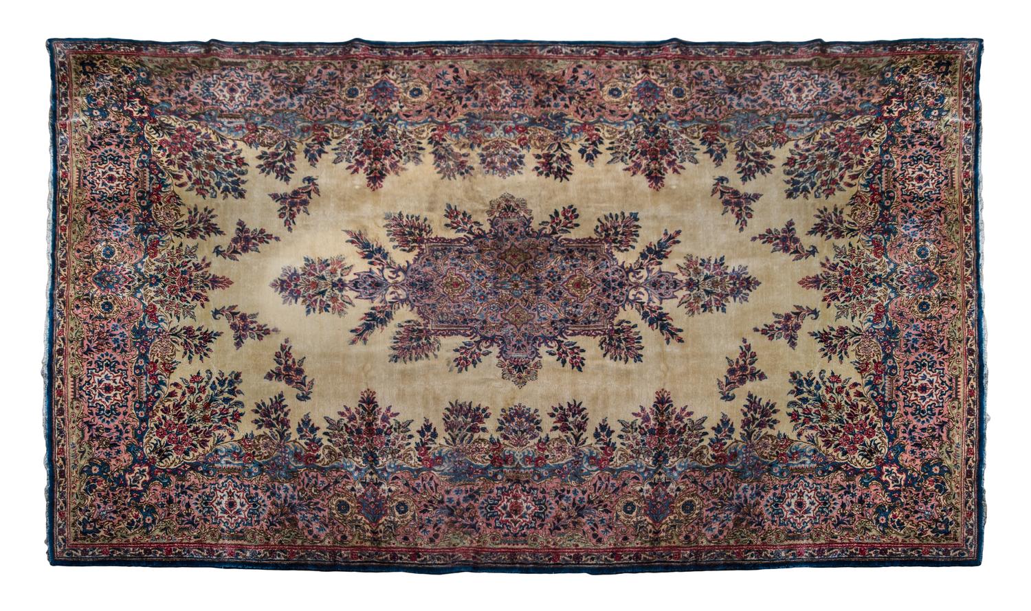 A Kirman Wool Rug 16 feet 2 inches x 9 feet 6 inches.