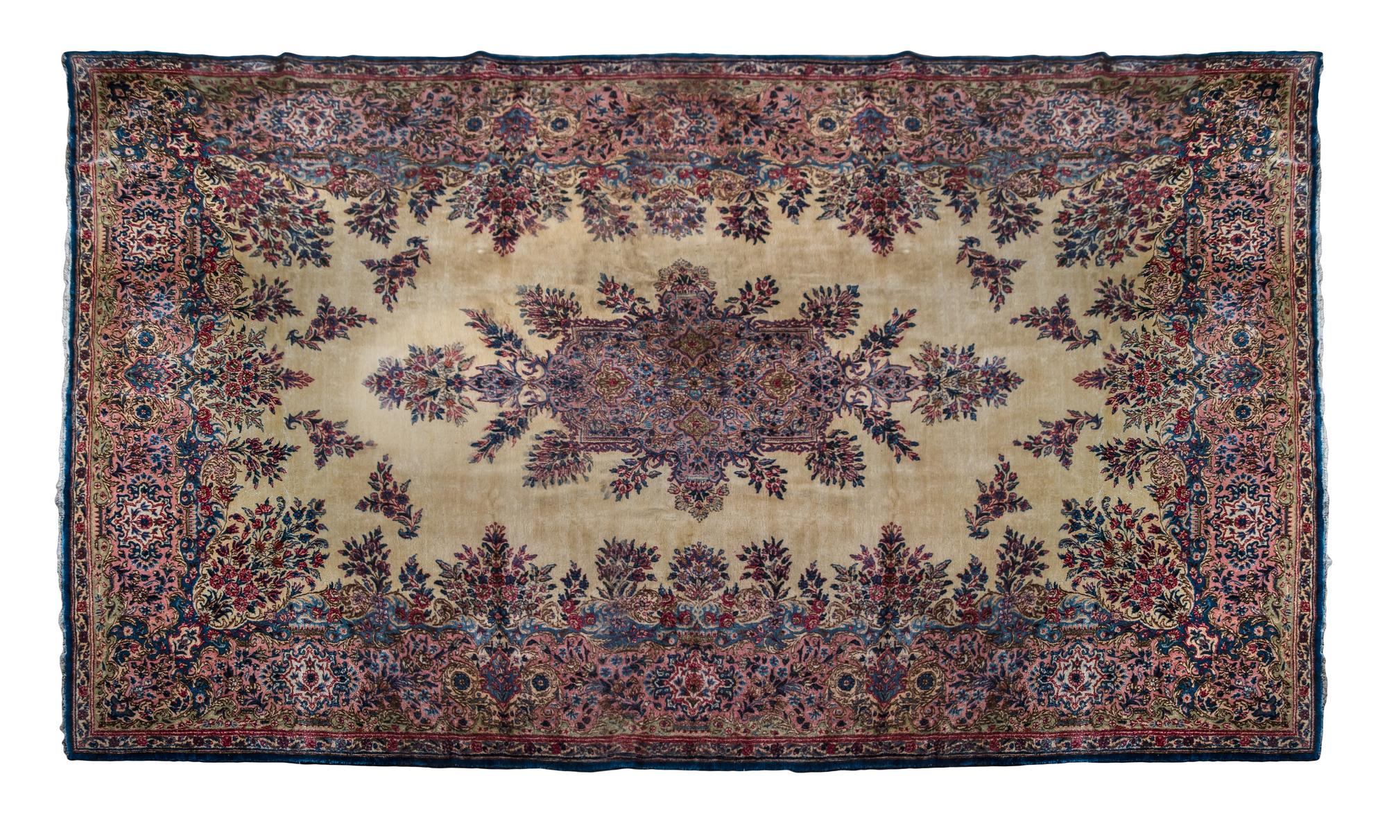 A Kirman Wool Rug 16 feet 2 inches x 9 feet 6 inches.