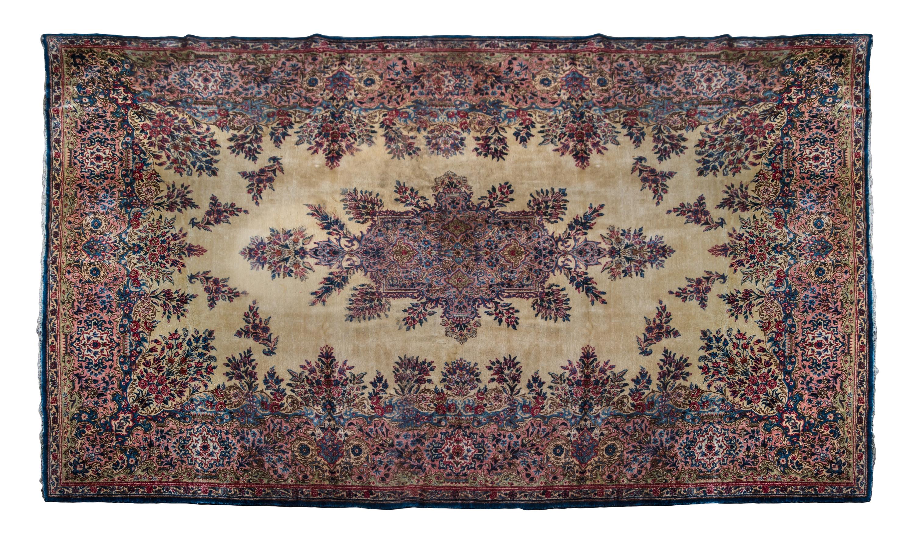 A Kirman Wool Rug 16 feet 2 inches x 9 feet 6 inches.
