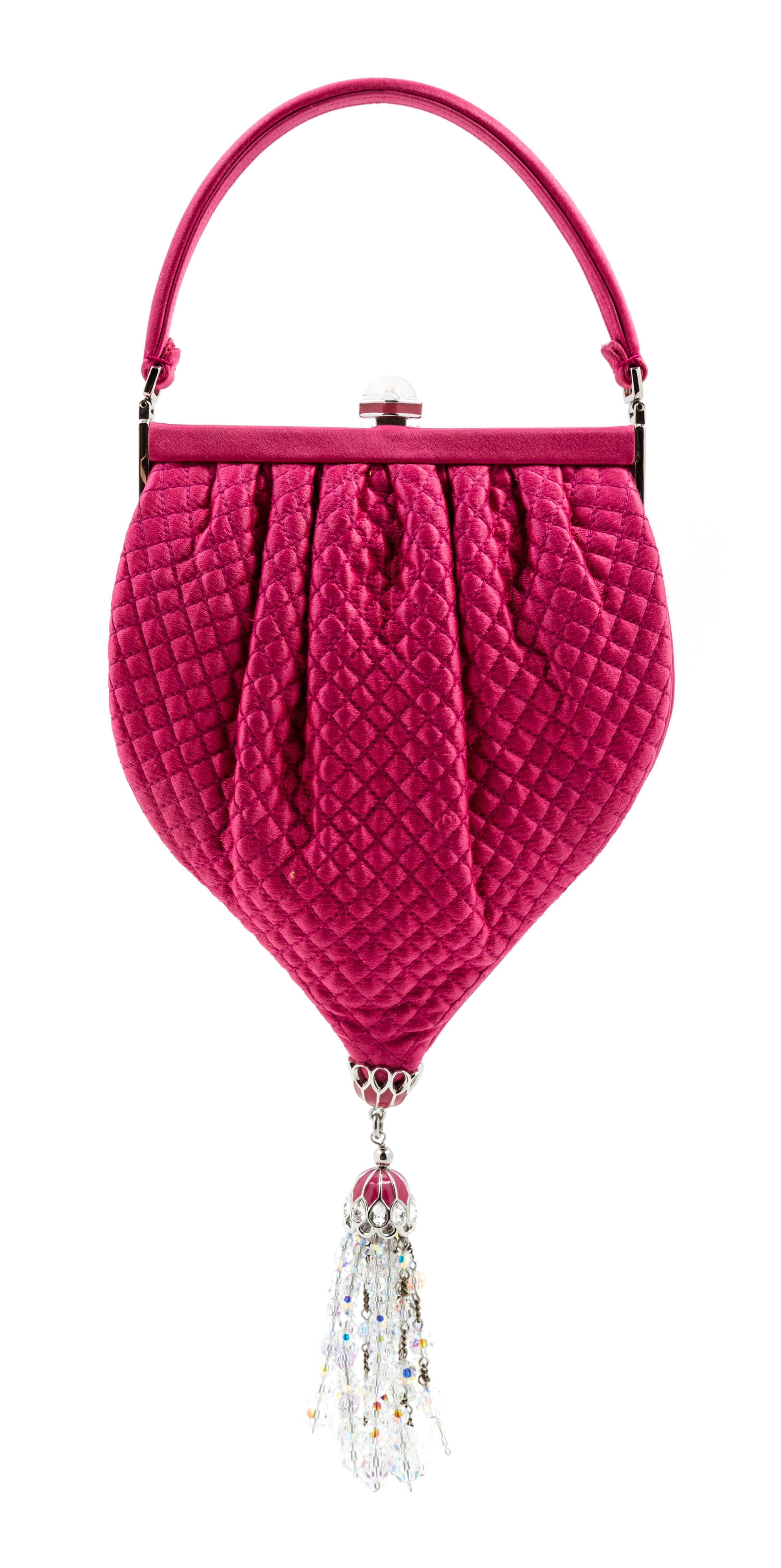 A Judith Leiber Pink Satin Quilted Handbag, 5.5" x 10" x 1"; Handle drop: 3".
