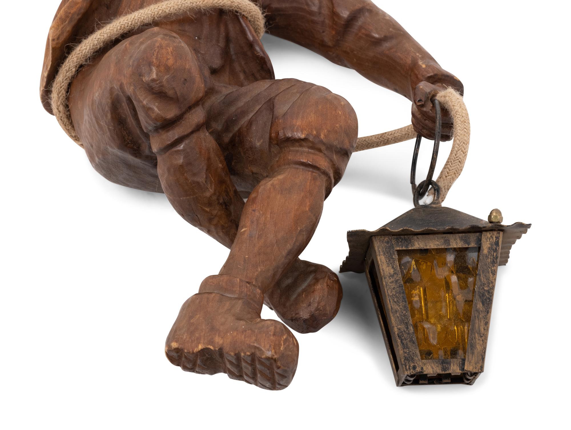 A Black Forest Carved Mountaineer Pendant Light