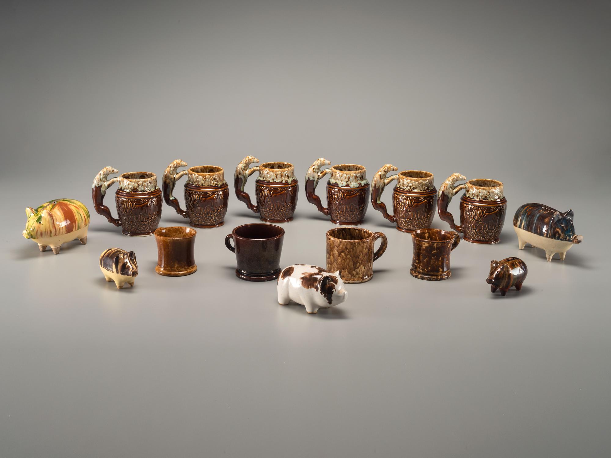 Fifteen Rockingham Glaze Mugs and Pig Banks