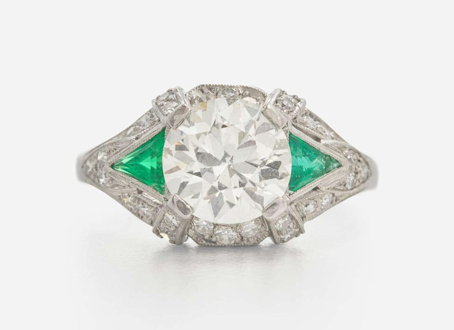 A Platinum, Diamond, and Emerald Art Deco Ring