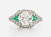 A Platinum, Diamond, and Emerald Art Deco Ring