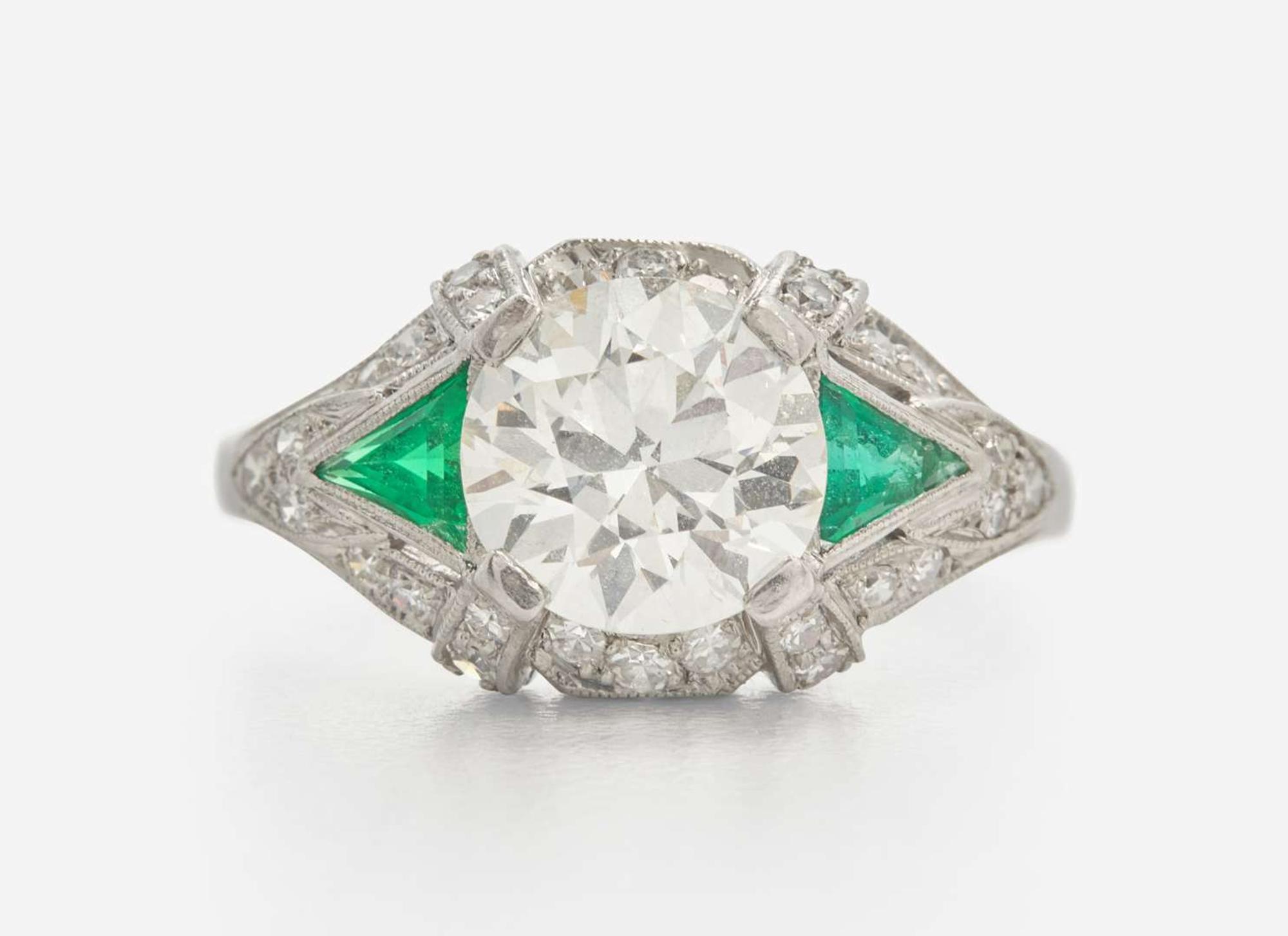 A Platinum, Diamond, and Emerald Art Deco Ring