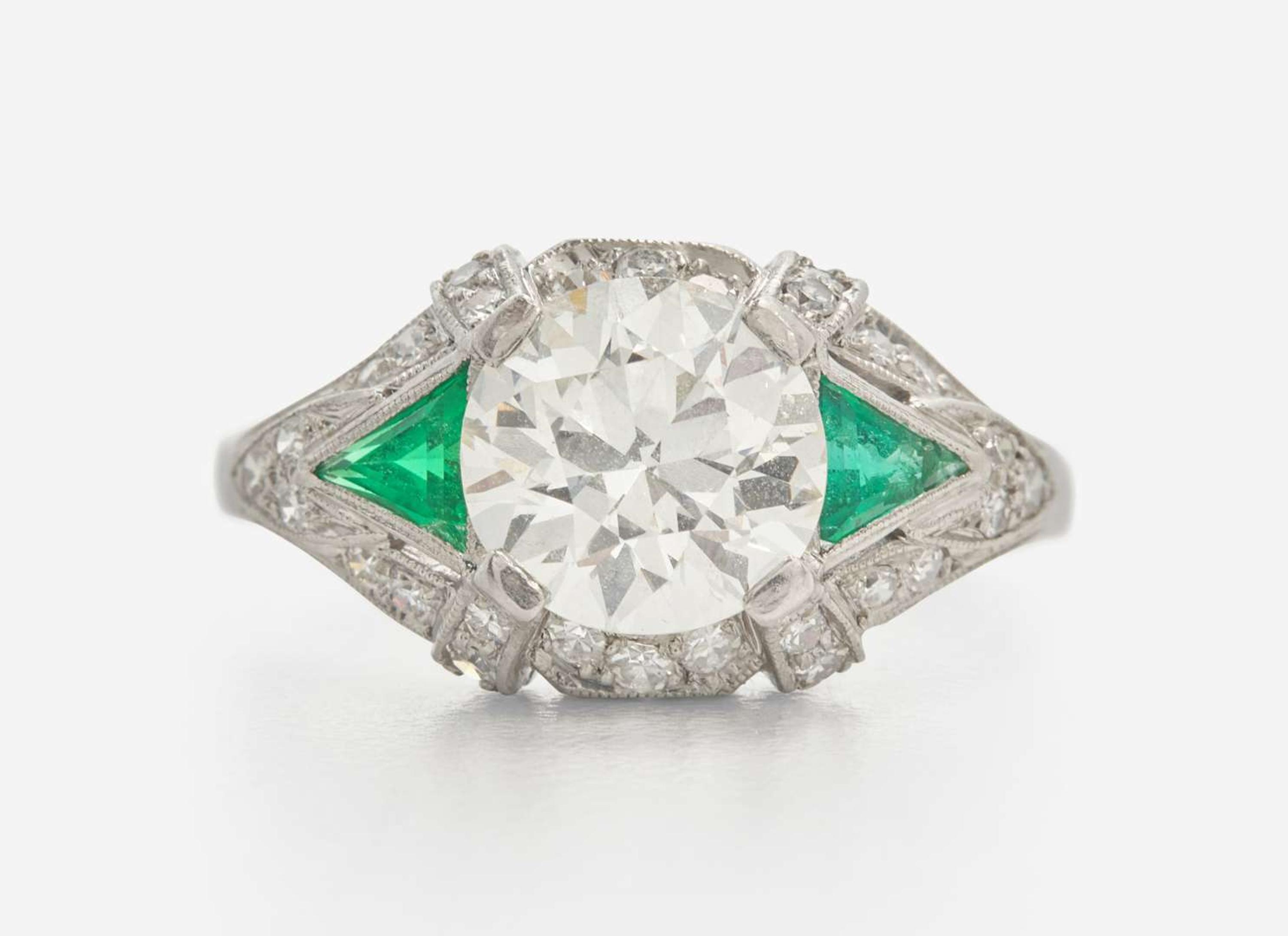 A Platinum, Diamond, and Emerald Art Deco Ring