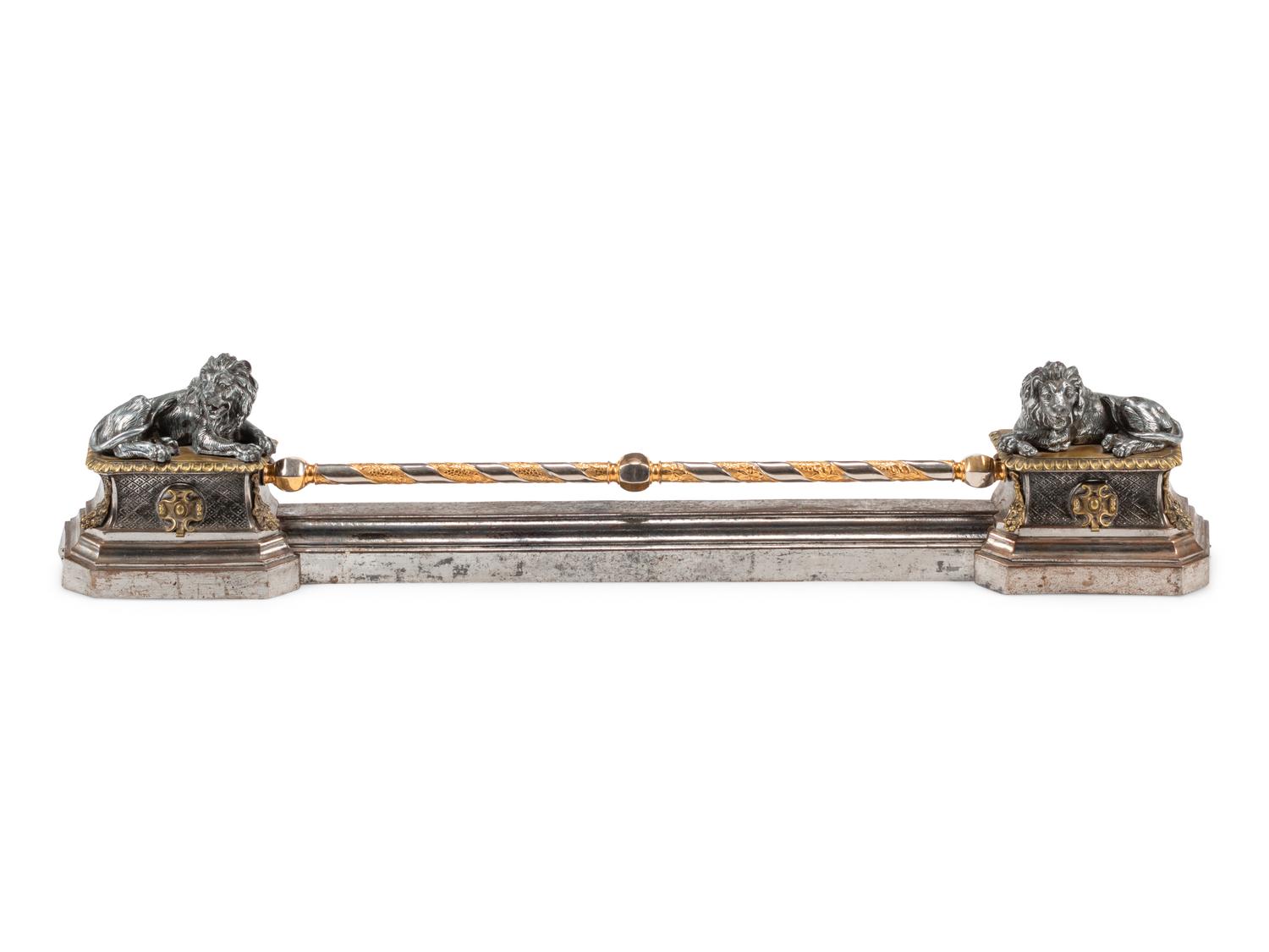 A Continental Steel and Gilt Bronze Fire Fender