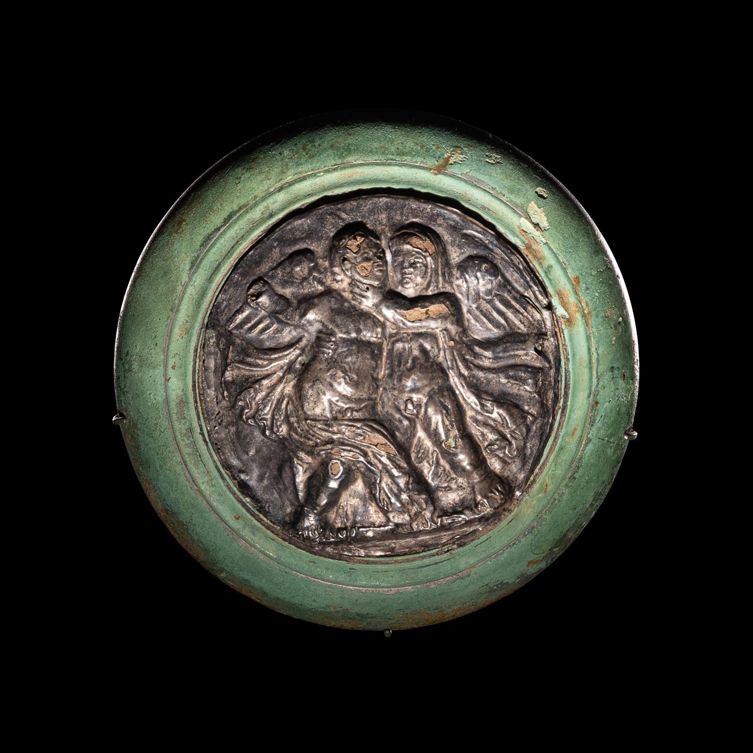 A Roman Silver and Bronze Boss with Erotes