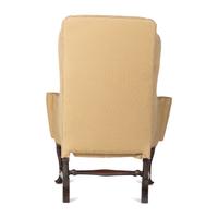 A Queen Anne Turned and Carved Walnut Stretcher Base and Pad Foot Easy Chair